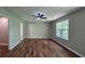 Bright bedroom showcasing luxury vinyl flooring, modern ceiling fan, and natural light at 5169 Hanover St, Atlanta, GA 30349