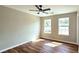 Bright bedroom with luxury vinyl flooring and double windows at 5169 Hanover St, Atlanta, GA 30349
