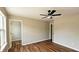 Bedroom showcasing luxury vinyl flooring, open doorways, and natural light at 5169 Hanover St, Atlanta, GA 30349