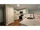 Modern kitchen with stainless steel appliances, white cabinets, and countertops at 5169 Hanover St, Atlanta, GA 30349