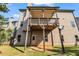 Backyard featuring wooden deck overlooking a well-maintained lawn at 1285 Brynhill Ct, Buford, GA 30518