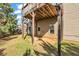Spacious backyard with a small patio area and deck overhead, perfect for relaxing and entertaining outdoors at 1285 Brynhill Ct, Buford, GA 30518