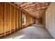 Unfinished basement with exposed wood framing, windows and concrete flooring at 1285 Brynhill Ct, Buford, GA 30518