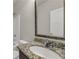 Close-up of bathroom vanity featuring granite countertop, white sink, and chrome faucet at 1285 Brynhill Ct, Buford, GA 30518