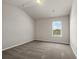 Cozy bedroom with large window providing natural light and carpeted floors at 1285 Brynhill Ct, Buford, GA 30518