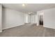 Expansive bedroom features neutral carpet, recessed lighting, and access to a bathroom at 1285 Brynhill Ct, Buford, GA 30518