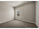Neutral bedroom with carpet, closet, and a window with tree view at 1285 Brynhill Ct, Buford, GA 30518