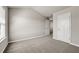 Bright bedroom with carpeted floor, neutral paint, and large windows and doors at 1285 Brynhill Ct, Buford, GA 30518