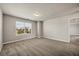 Spacious bedroom with large windows, neutral carpeting, and plenty of natural light at 1285 Brynhill Ct, Buford, GA 30518