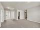 Large bedroom with neutral carpet, recessed lights, and multiple doorways at 1285 Brynhill Ct, Buford, GA 30518