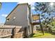 Home's exterior showcases a fenced yard and a wooden deck for enjoying the outdoors at 1285 Brynhill Ct, Buford, GA 30518