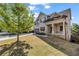 Attractive two-story home with a well-kept lawn, two car garage and inviting front porch at 1285 Brynhill Ct, Buford, GA 30518