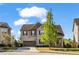 Charming two-story brick home featuring a well-manicured lawn and attached garage at 1285 Brynhill Ct, Buford, GA 30518