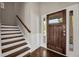 Inviting foyer with hardwood floors and staircase leading to the upper level at 1285 Brynhill Ct, Buford, GA 30518