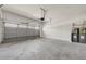 Spacious garage with concrete floors, overhead door, and water heaters at 1285 Brynhill Ct, Buford, GA 30518