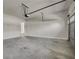 Open garage space with mechanical door and concrete floor at 1285 Brynhill Ct, Buford, GA 30518