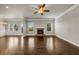 Spacious living room features hardwood floors, fireplace, and bright windows at 1285 Brynhill Ct, Buford, GA 30518