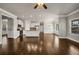 Bright open-plan living area featuring hardwood floors, white trim, and a seamless flow to the kitchen at 1285 Brynhill Ct, Buford, GA 30518