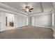 Large main bedroom features tray ceilings, fan, and en-suite bathroom with double vanity at 1285 Brynhill Ct, Buford, GA 30518