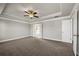 Spacious main bedroom features tray ceilings, fan, and an en-suite bathroom at 1285 Brynhill Ct, Buford, GA 30518