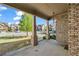 Covered porch, showing view of the street with neighborhood homes and landscaping at 1285 Brynhill Ct, Buford, GA 30518