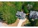 An aerial view of the home and property with lots of mature trees and a two car garage at 1326 Benbrooke Nw Ln, Acworth, GA 30101