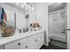 Bright bathroom boasts a double sink vanity, modern fixtures, and a shower-tub combo at 1326 Benbrooke Nw Ln, Acworth, GA 30101