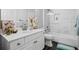 Stylish bathroom with white vanity, modern fixtures, and shower-tub combo at 1326 Benbrooke Nw Ln, Acworth, GA 30101