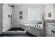 Beautiful bathroom with separate shower and soaker tub with a large glass block window at 1326 Benbrooke Nw Ln, Acworth, GA 30101