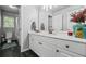 Bright bathroom vanity with double sink, mirror, and contemporary design at 1326 Benbrooke Nw Ln, Acworth, GA 30101
