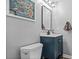 A half bathroom featuring a sleek vanity, modern mirror, and tasteful decor that enhances the room's appeal at 1326 Benbrooke Nw Ln, Acworth, GA 30101