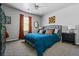 Inviting bedroom with large window, and blue quilt with accent pillows at 1326 Benbrooke Nw Ln, Acworth, GA 30101