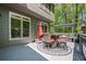 Outdoor dining setup on a spacious deck, complete with comfortable seating and a scenic backyard view at 1326 Benbrooke Nw Ln, Acworth, GA 30101