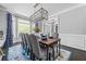 Bright dining room featuring a large bay window and hardwood floors at 1326 Benbrooke Nw Ln, Acworth, GA 30101