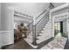 Elegant staircase and foyer leading to the living area and upper levels of the home at 1326 Benbrooke Nw Ln, Acworth, GA 30101