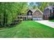 Charming home with a manicured lawn, stone accents, and a welcoming front porch at 1326 Benbrooke Nw Ln, Acworth, GA 30101