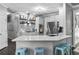 Modern kitchen with white cabinets, stainless steel appliances, and marble countertops with breakfast bar at 1326 Benbrooke Nw Ln, Acworth, GA 30101