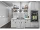 Well-equipped kitchen with modern appliances, white cabinets, and ample countertop space at 1326 Benbrooke Nw Ln, Acworth, GA 30101