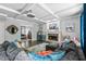 Cozy living room with coffered ceilings, stone fireplace, and comfortable seating at 1326 Benbrooke Nw Ln, Acworth, GA 30101