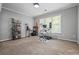 Bright office featuring neutral colors, contemporary desk, and a large window at 1326 Benbrooke Nw Ln, Acworth, GA 30101