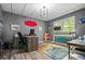 Comfortable home office with wood floors, colorful accent decorations, a custom desk and a window offering plenty of natural light at 1326 Benbrooke Nw Ln, Acworth, GA 30101