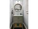 Stylish powder room with modern vanity, decorative mirror, and updated fixtures at 1326 Benbrooke Nw Ln, Acworth, GA 30101