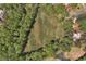 Aerial view of horse pasture land surrounded by trees at 1819 Yorkshire Dr, Woodstock, GA 30189