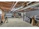 Large, unfinished basement with exposed beams, offering plenty of room for storage or potential expansion at 1819 Yorkshire Dr, Woodstock, GA 30189