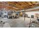 Spacious unfinished basement with exposed beams, offering potential for customization and ample storage at 1819 Yorkshire Dr, Woodstock, GA 30189