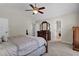 Primary bedroom featuring ample closet space, a ceiling fan, and ensuite bathroom access at 1819 Yorkshire Dr, Woodstock, GA 30189