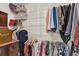 Walk-in closet featuring shelves, drawers, and hanging racks for ample storage at 1819 Yorkshire Dr, Woodstock, GA 30189