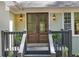 Close-up of the beautiful double front doors with sidelight windows and decorative lanterns at 1819 Yorkshire Dr, Woodstock, GA 30189