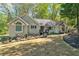 Charming single story home with well-maintained landscaping and inviting curb appeal on a sunny day at 1819 Yorkshire Dr, Woodstock, GA 30189