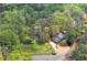 Aerial view of gray two-story home, complemented by a lush green lawn and a driveway leading to the residence at 1819 Yorkshire Dr, Woodstock, GA 30189